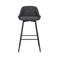 Tabouret de bar moderne en tissu gris avec pieds en métal noir.